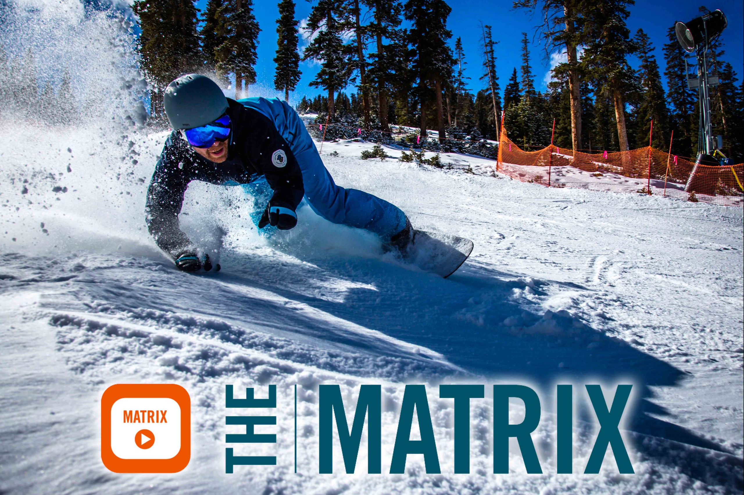 A snowboarder carves across the snow and image reads the matrix