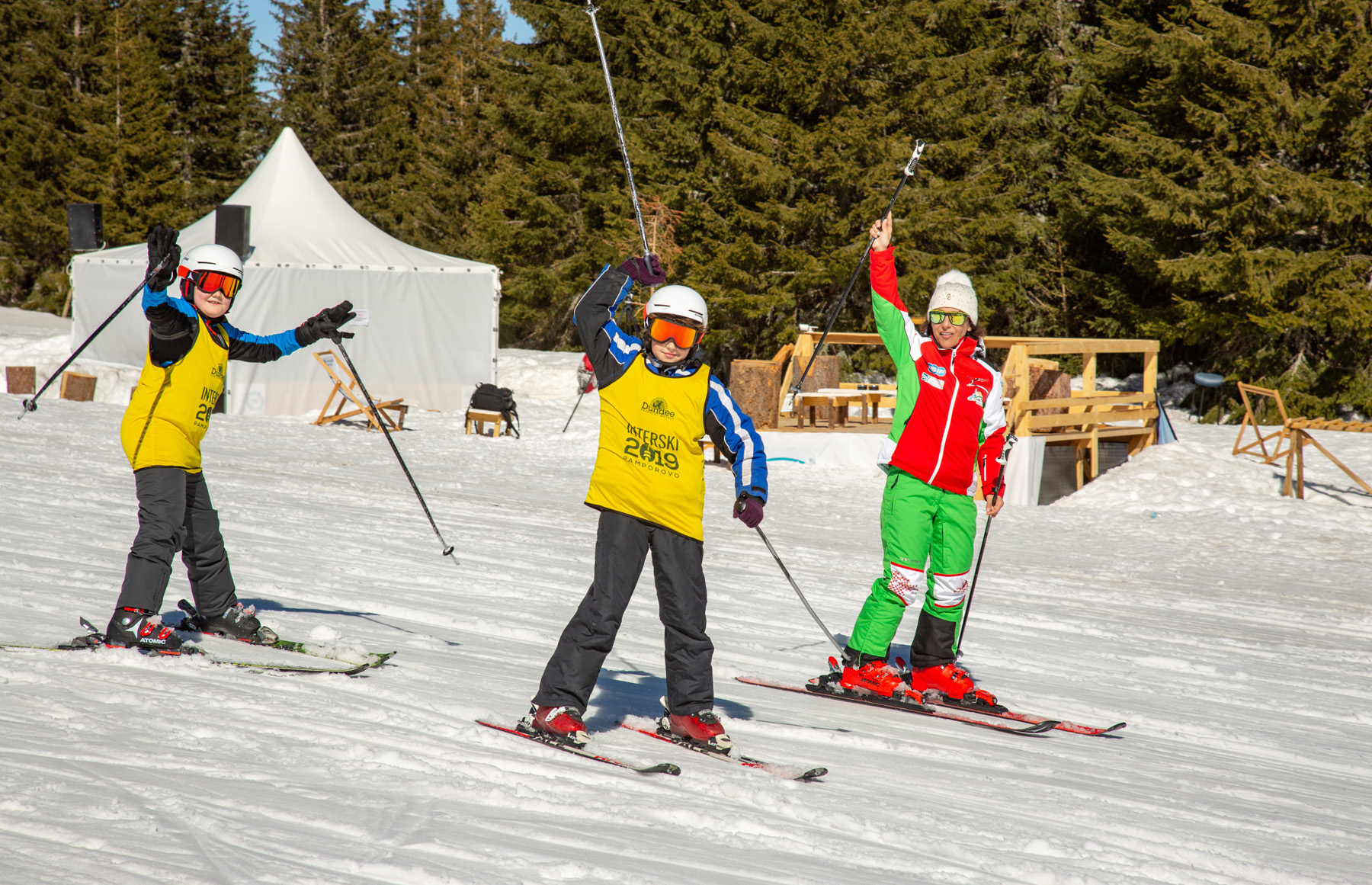 Interski ski school students with their instructor at Interski 2019