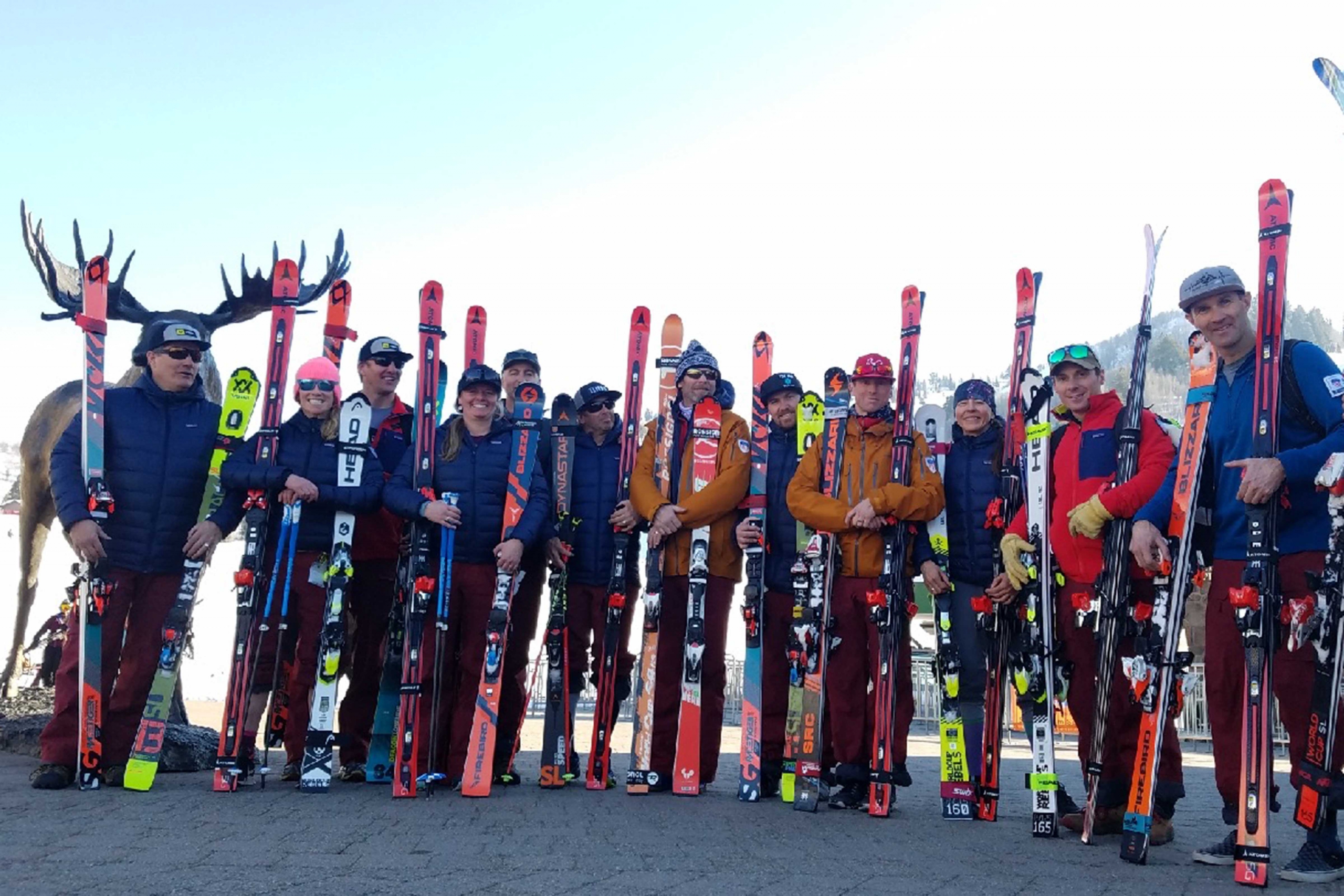 The PSIA Alpine Team holding Atomic Super G skis