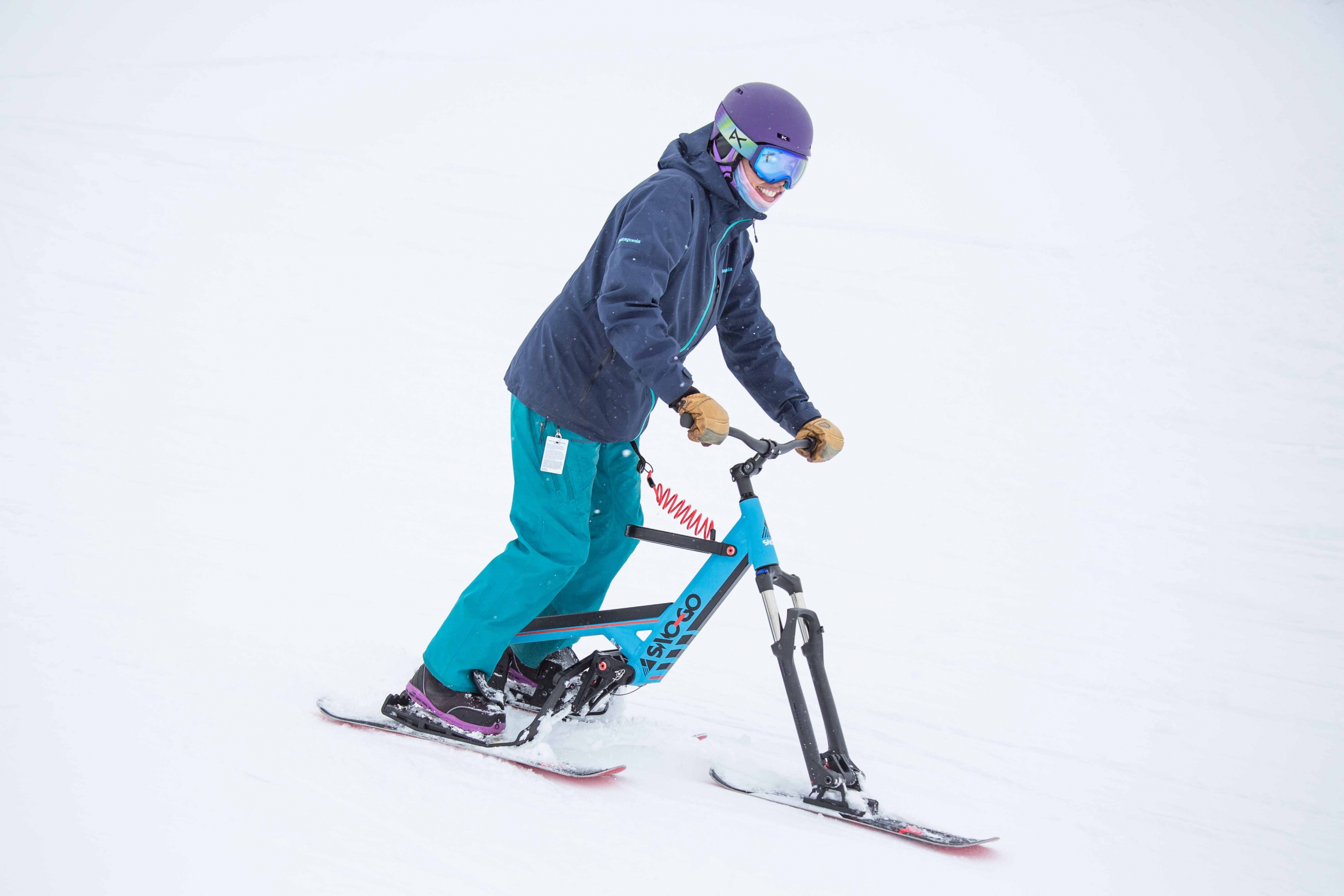 A sno-go rider on the ski hill